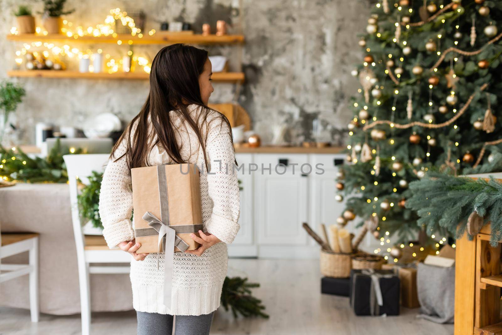 Happy little smiling girl with christmas gift box. by Andelov13