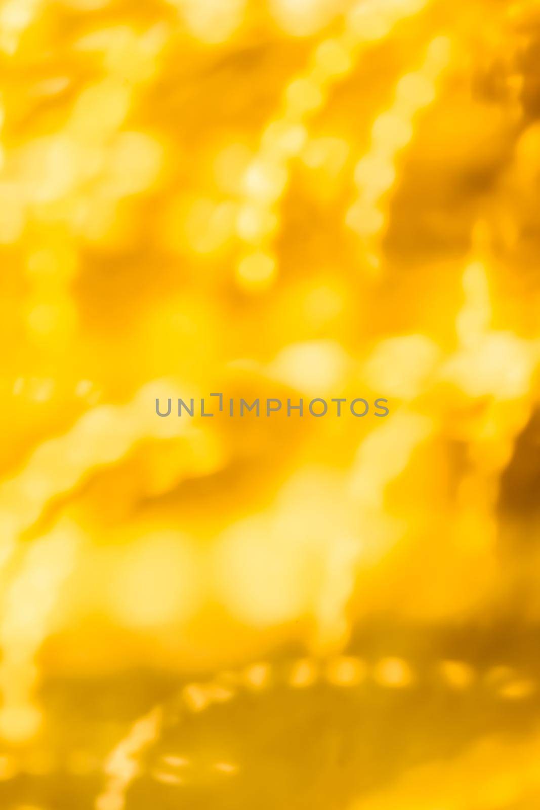 Golden Christmas lights, New Years Eve fireworks and abstract texture concept - Glamorous gold shiny glow and glitter, luxury holiday background