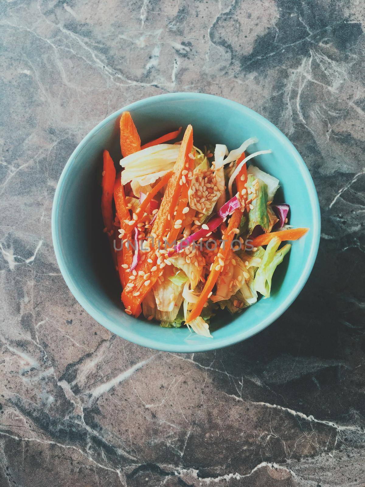 Vegan dieting, eating out and oriental cuisine concept - Vegetarian asian vegetable salad served in a bowl in japanese restaurant, healthy diet food