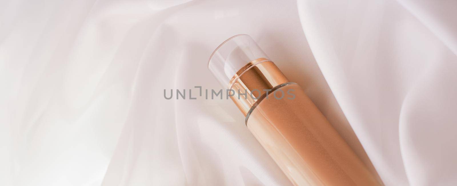 Tonal bb cream bottle make-up fluid foundation base for nude skin color on silk background, cosmetics product as luxury beauty brand holiday design by Anneleven