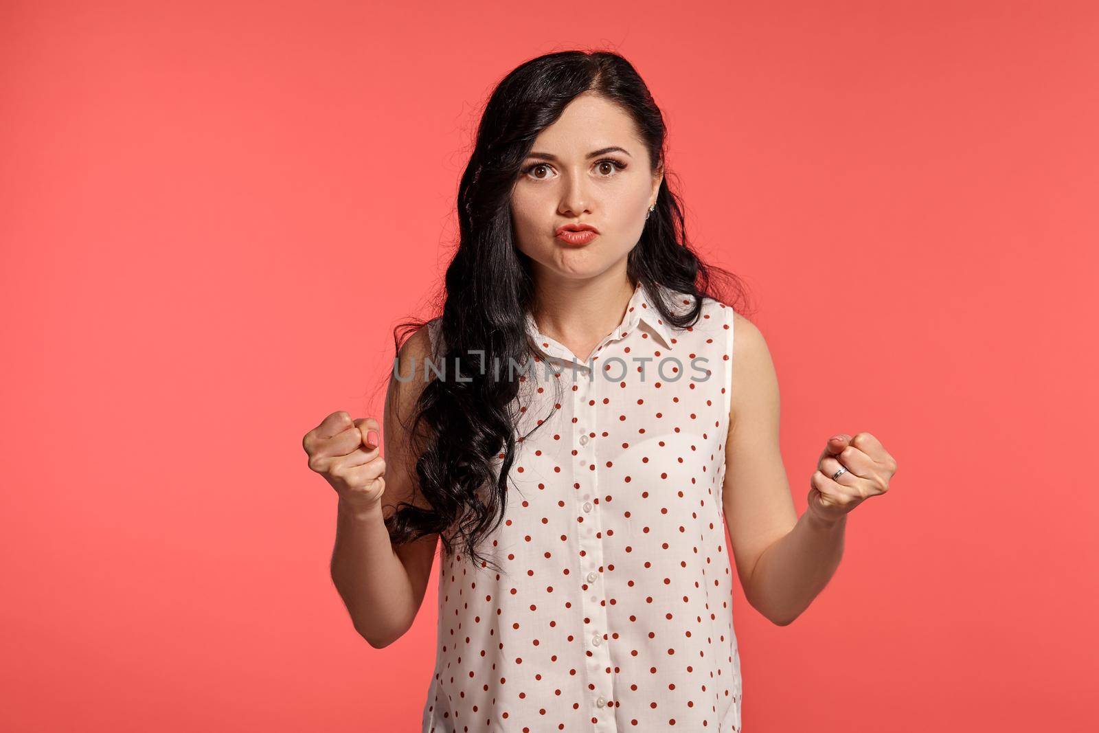 Studio shot of a beautiful girl teenager posing over a pink background. by nazarovsergey