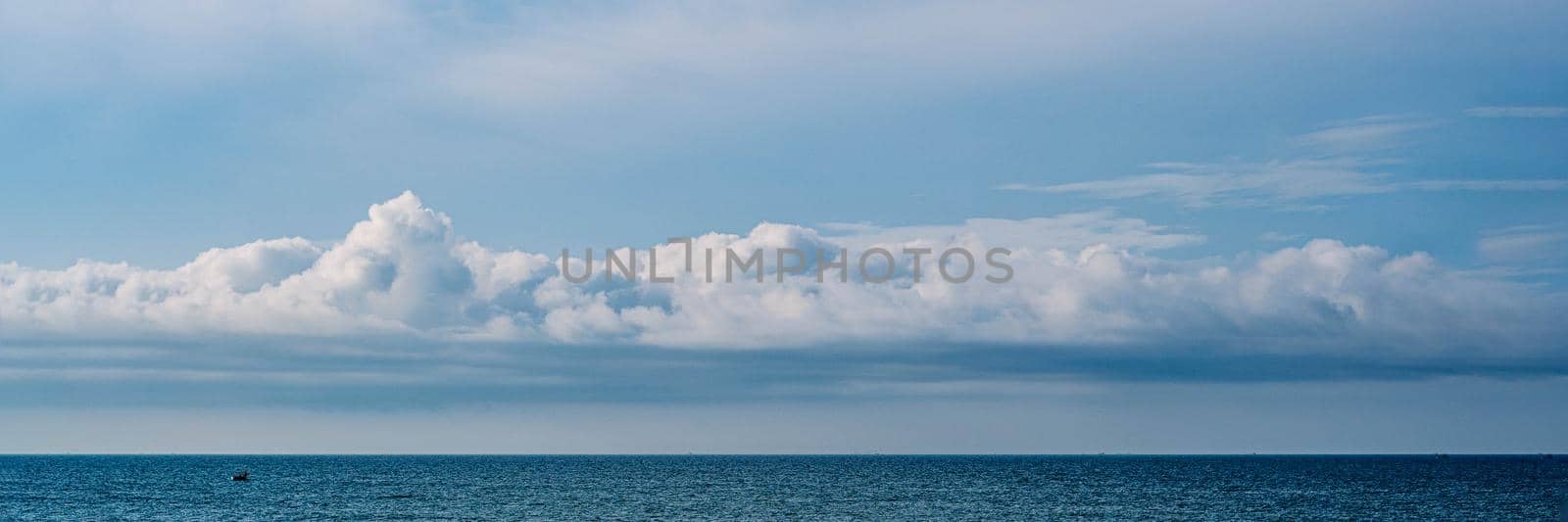BANNER, LONG FORMAT, crop it. Atmosphere panorama white cloud clear blue sky horizon line calm empty sea. Concept paradise life. Design relax wallpaper background. More tone format collection in stock by nandrey85