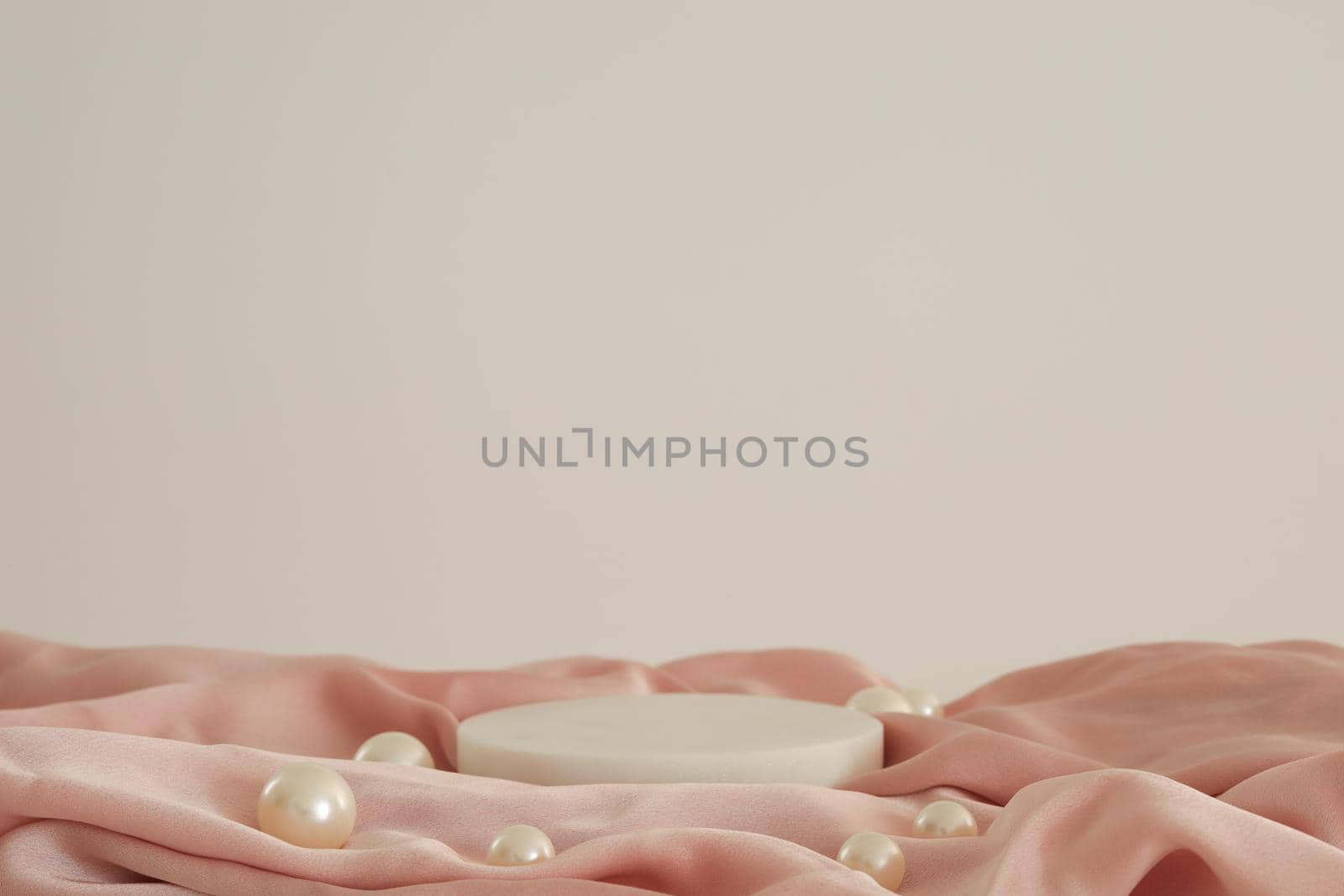 White marble podium on the pink silk fabric with pearls, white background. Podium for product, cosmetic presentation. Creative mock up. Pedestal or platform for beauty products. by creativebird