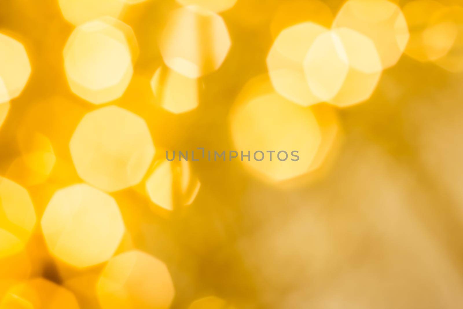 Golden Christmas lights, New Years Eve fireworks and abstract texture concept - Glamorous gold shiny glow and glitter, luxury holiday background