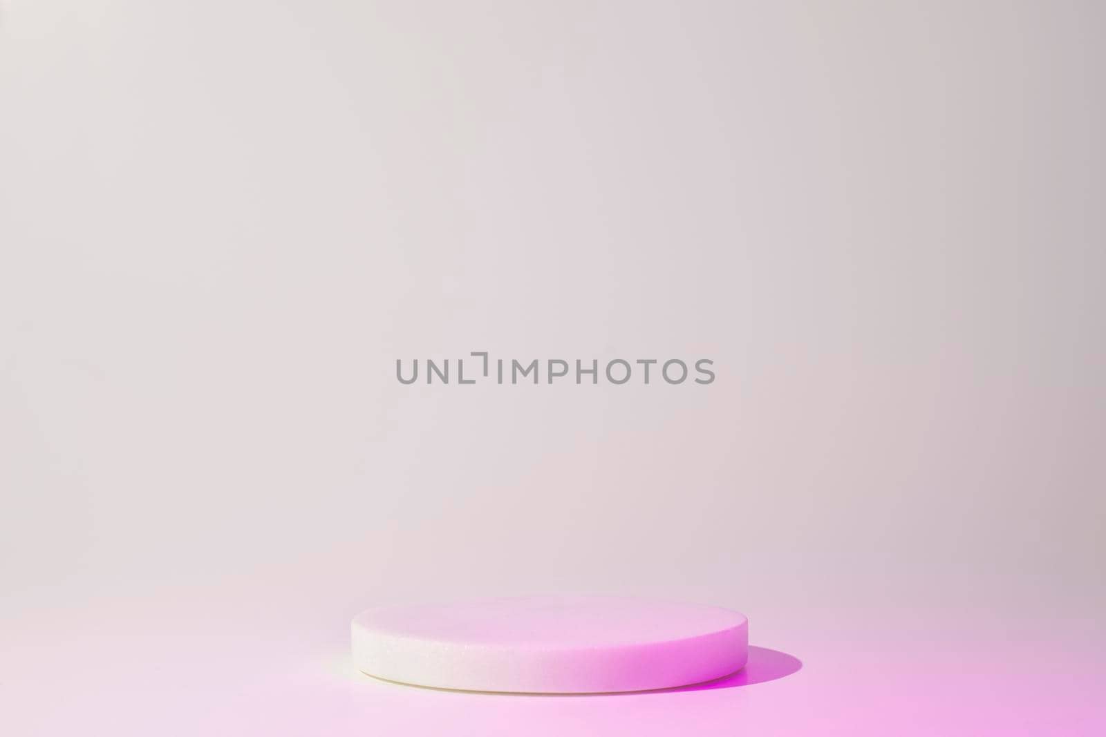 Podium with neon colors for product, cosmetic presentation. Creative mock up in pink, magenta and white. Pedestal or platform for beauty products