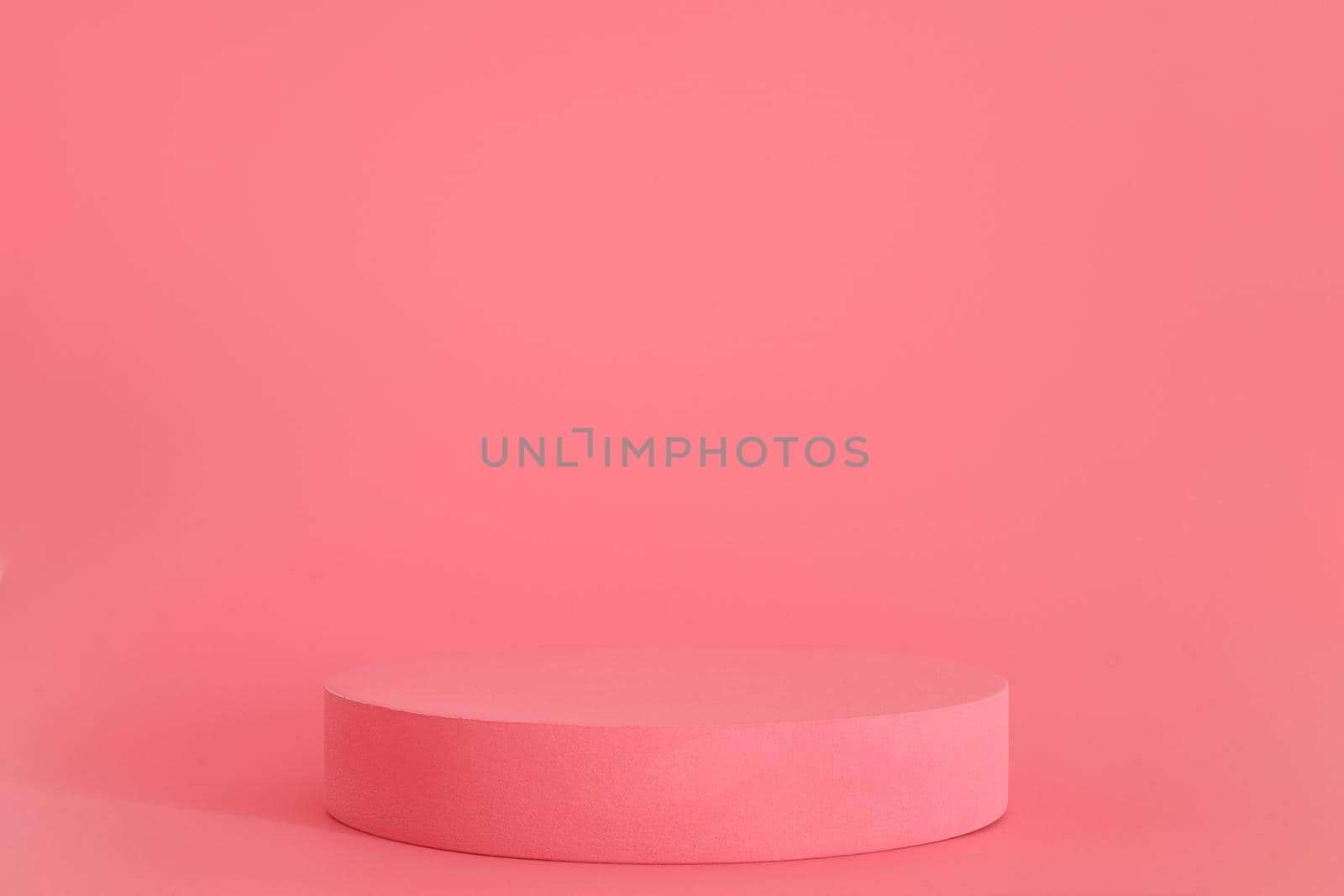 Pink podium on the pink background. Podium for product, cosmetic presentation. Creative mock up. Pedestal or platform for beauty products. by creativebird