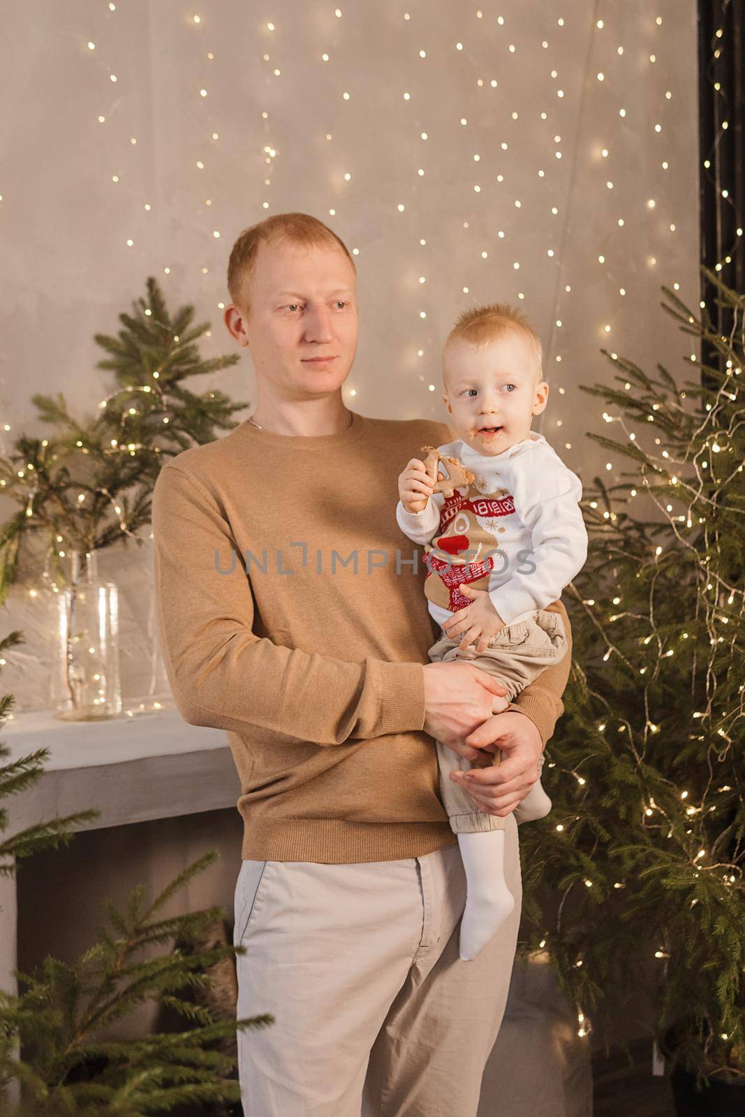 Dad and his little son in a magical Christmas atmosphere. The concept of family relations and New Year celebrations. by Annu1tochka