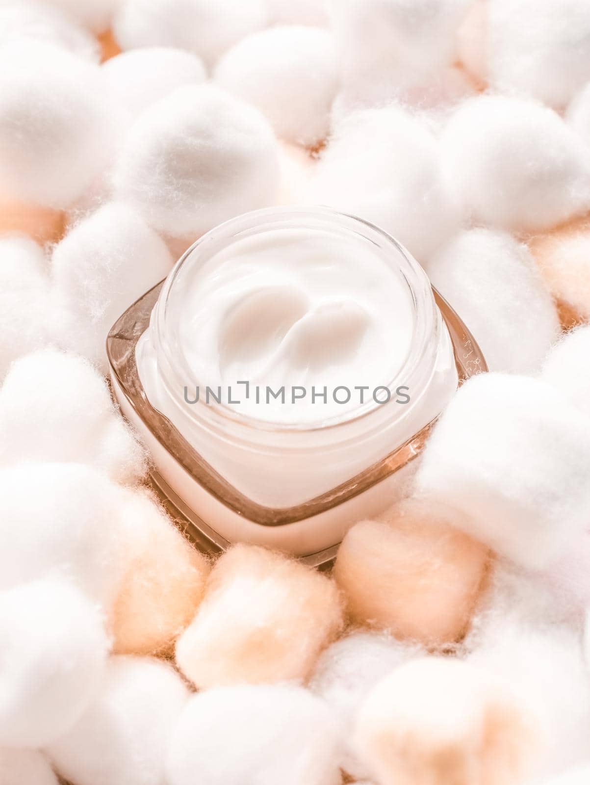 Cosmetic branding, moisturizing emulsion and facial care concept - Luxury face cream for sensitive skin and orange cotton balls on background, spa cosmetics and natural skincare beauty brand product