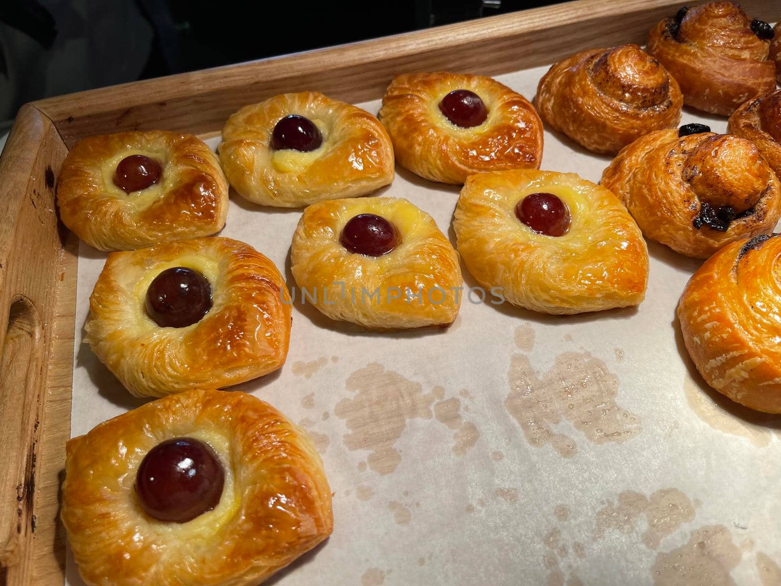 freshly baked danish pastry with apricot jam fruity jelly super delicious warm fresh buttery baked pastries with apricot and peach in bakery kitchen