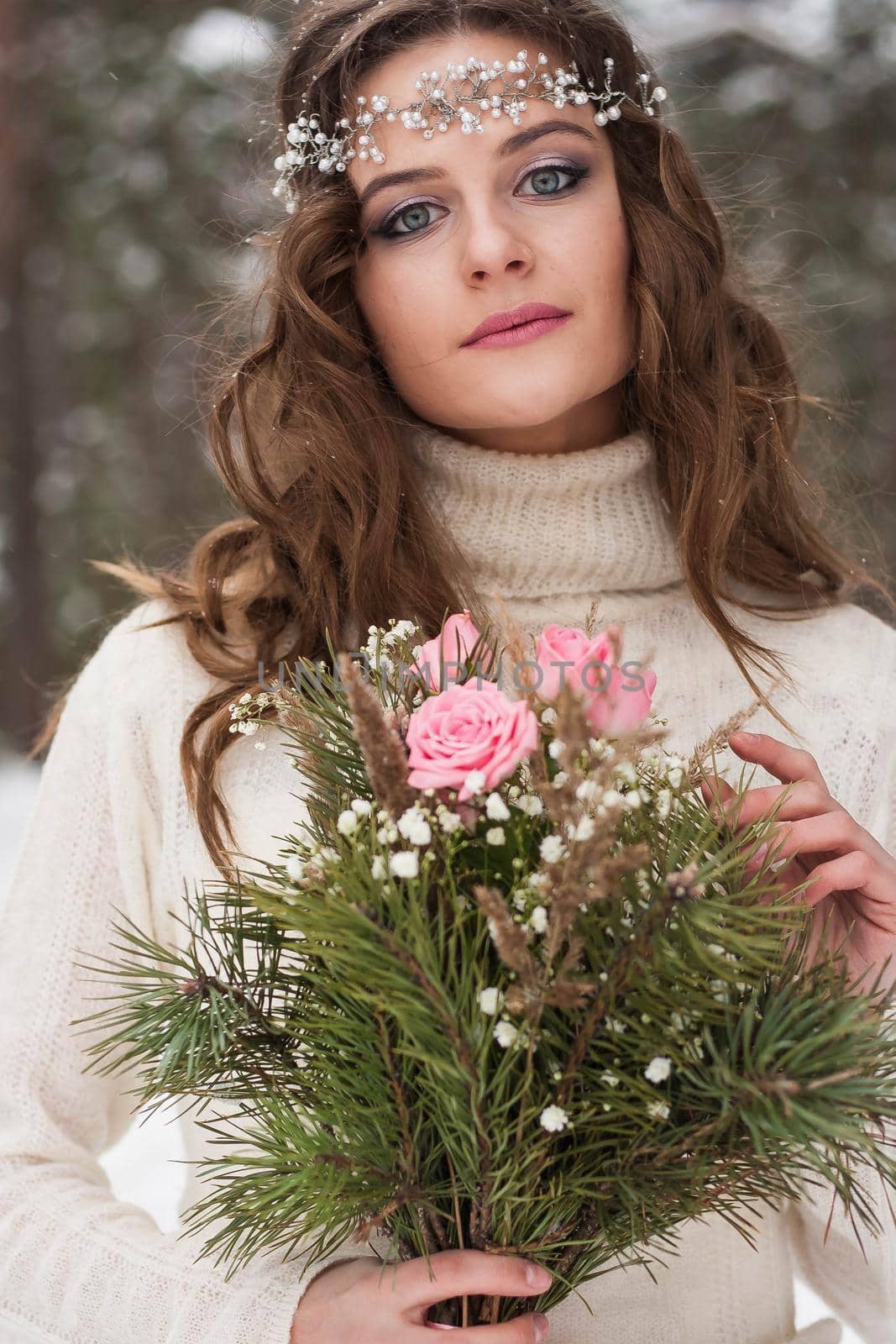 Beautiful bride in a white dress with a bouquet in a snow-covered winter forest. Portrait of the bride in nature. by Annu1tochka