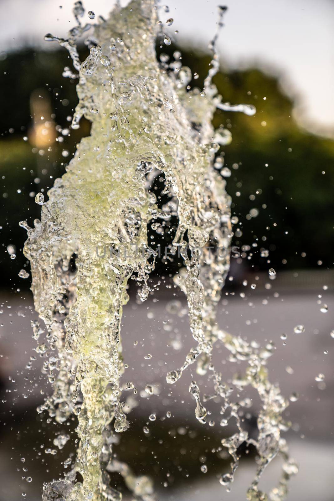 A jet of fountain water in the air. taken on a short shutter speed