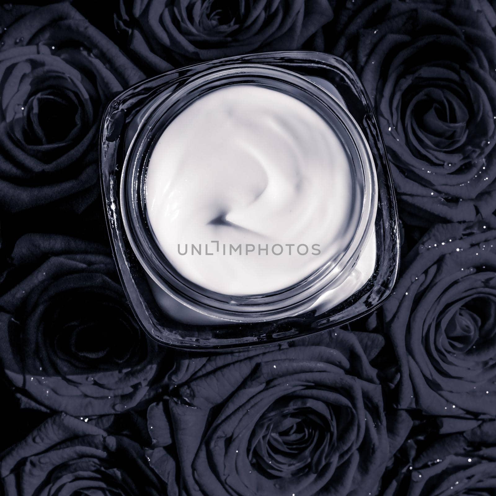 Luxe cosmetics, branding and anti-age concept - Face cream skin moisturizer and black roses flowers, luxury skincare cosmetic product on floral background as beauty brand holiday flatlay design