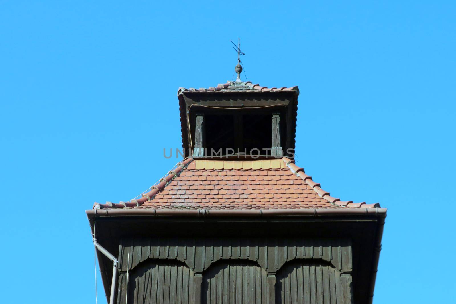 The old wooden part of the dome of a church or church against the sky