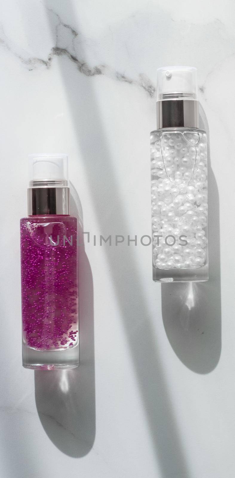 Cosmetic branding, packaging and make-up concept - Skin care serum and gel bottle, moisturizing lotion and lifting cream emulsion on marble, anti-age cosmetics for luxury beauty skincare brand design