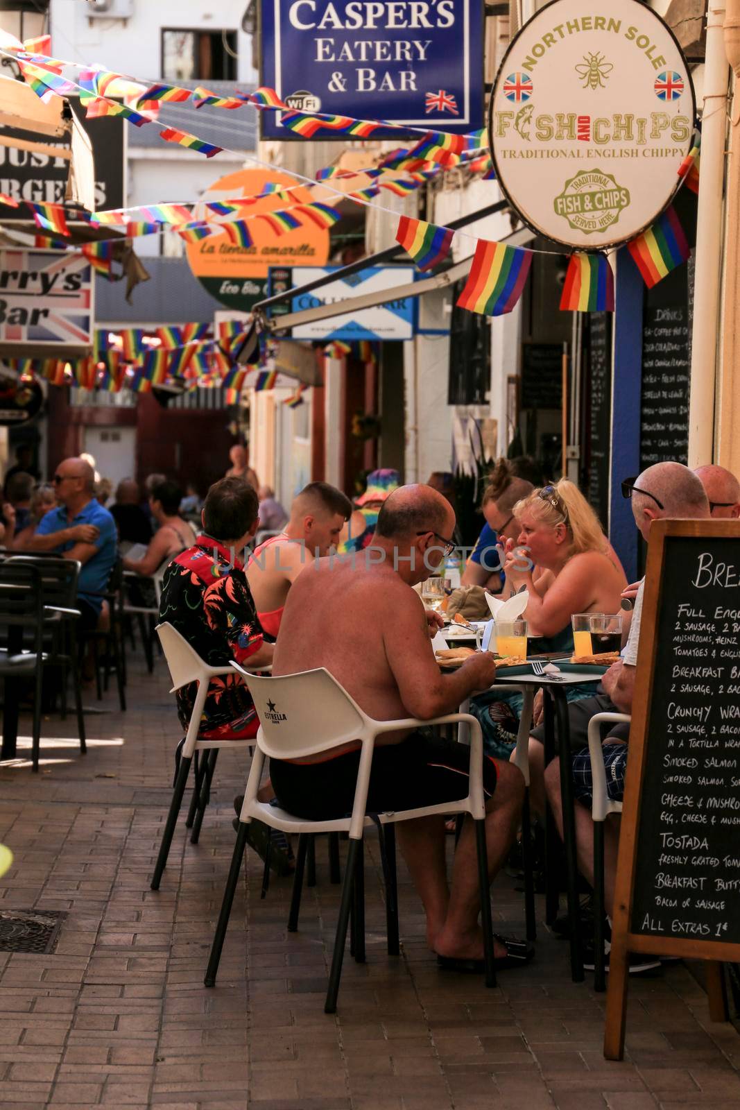 Benidorm, Alicante, Spain- September 10, 2022: Bars and terraces of typical spanish food full of people in the old town of Benidorm