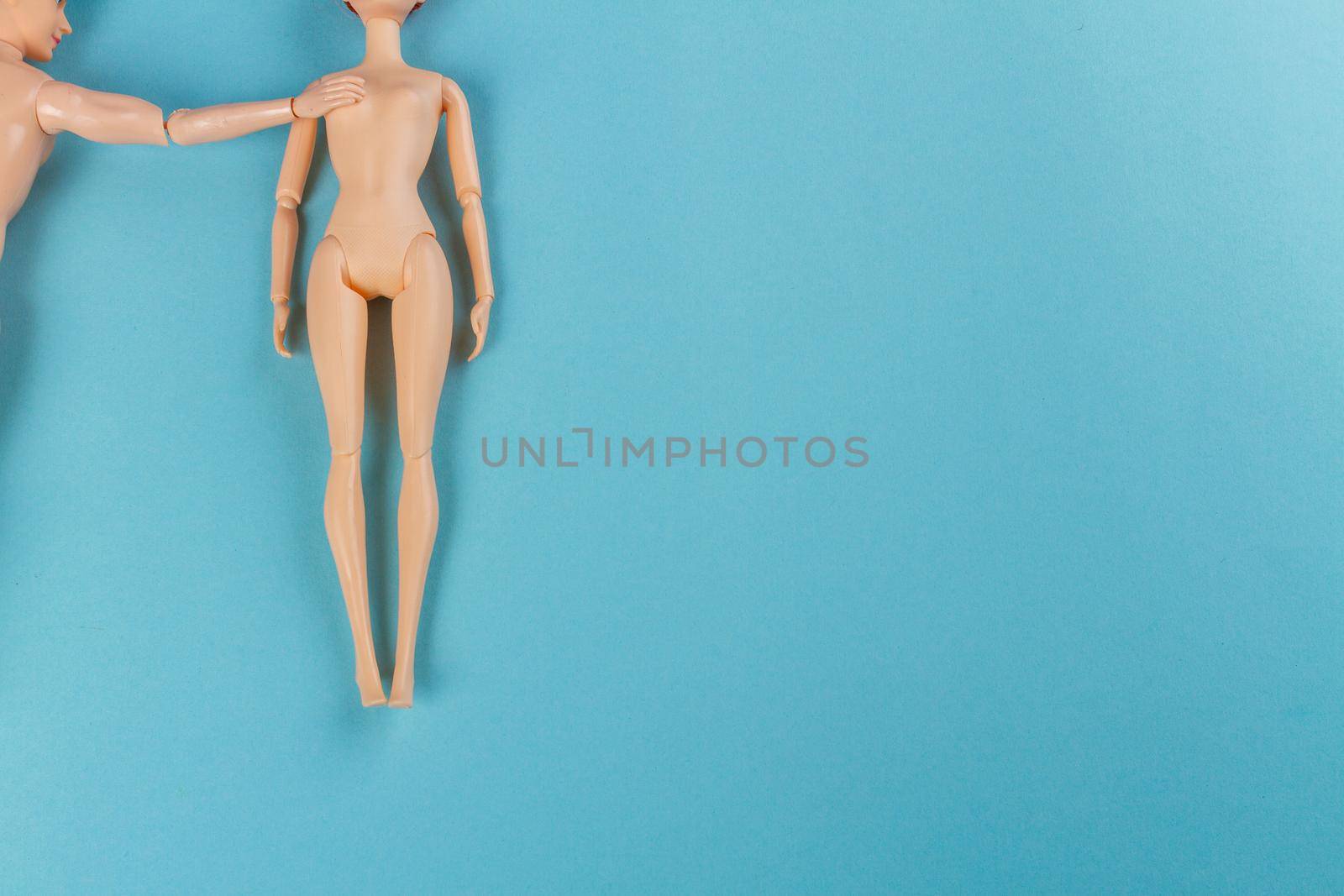 Back view naked doll man touching shoulder of woman. by super_picture