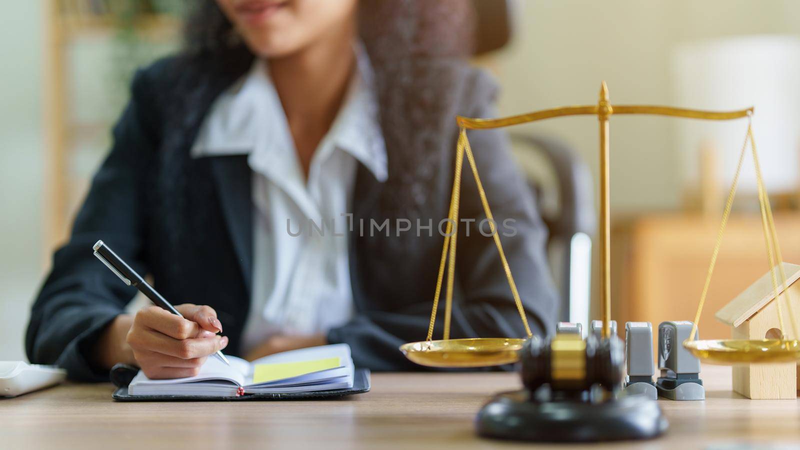 Lawyer business woman working or reading lawbook in office workplace for consultant lawyer concept by itchaznong