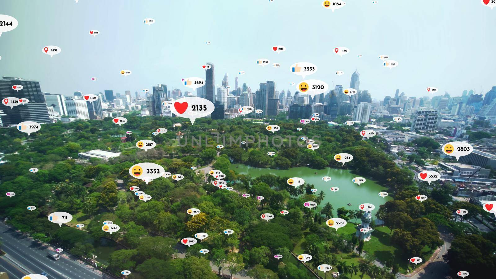 Social media icons fly over city downtown showing people reciprocity connection through social network application platform . Concept for online community and social media marketing strategy .