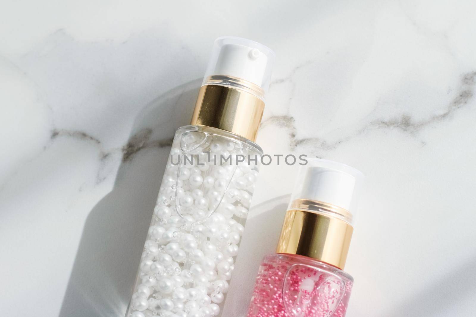 Cosmetic branding, packaging and make-up concept - Skin care serum and gel bottle, moisturizing lotion and lifting cream emulsion on marble, anti-age cosmetics for luxury beauty skincare brand design