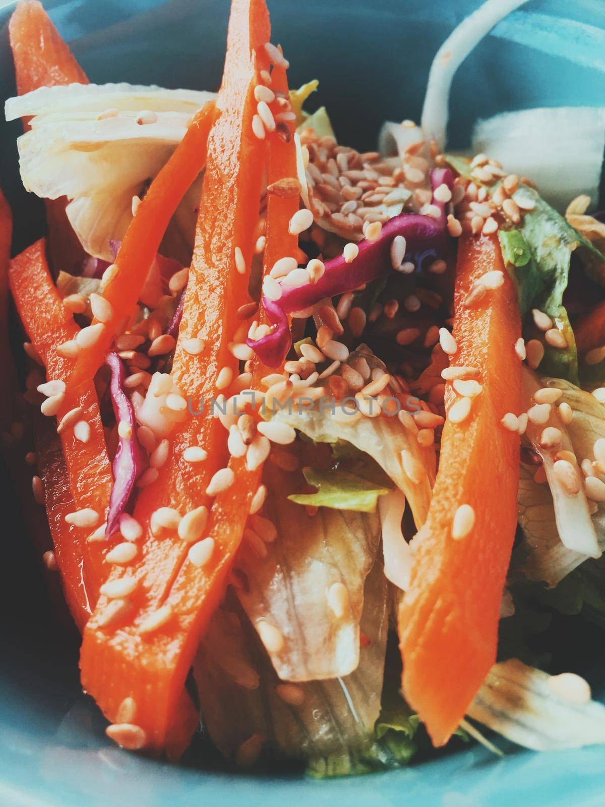 Vegan dieting, eating out and oriental cuisine concept - Vegetarian asian vegetable salad served in a bowl in japanese restaurant, healthy diet food