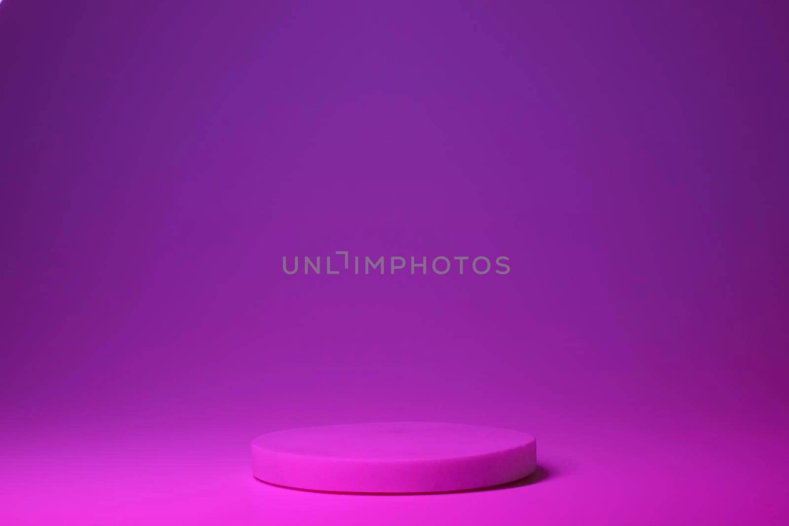 Podium with neon colors for product, cosmetic presentation. Creative mock up in pink and magenta. Pedestal or platform for beauty products