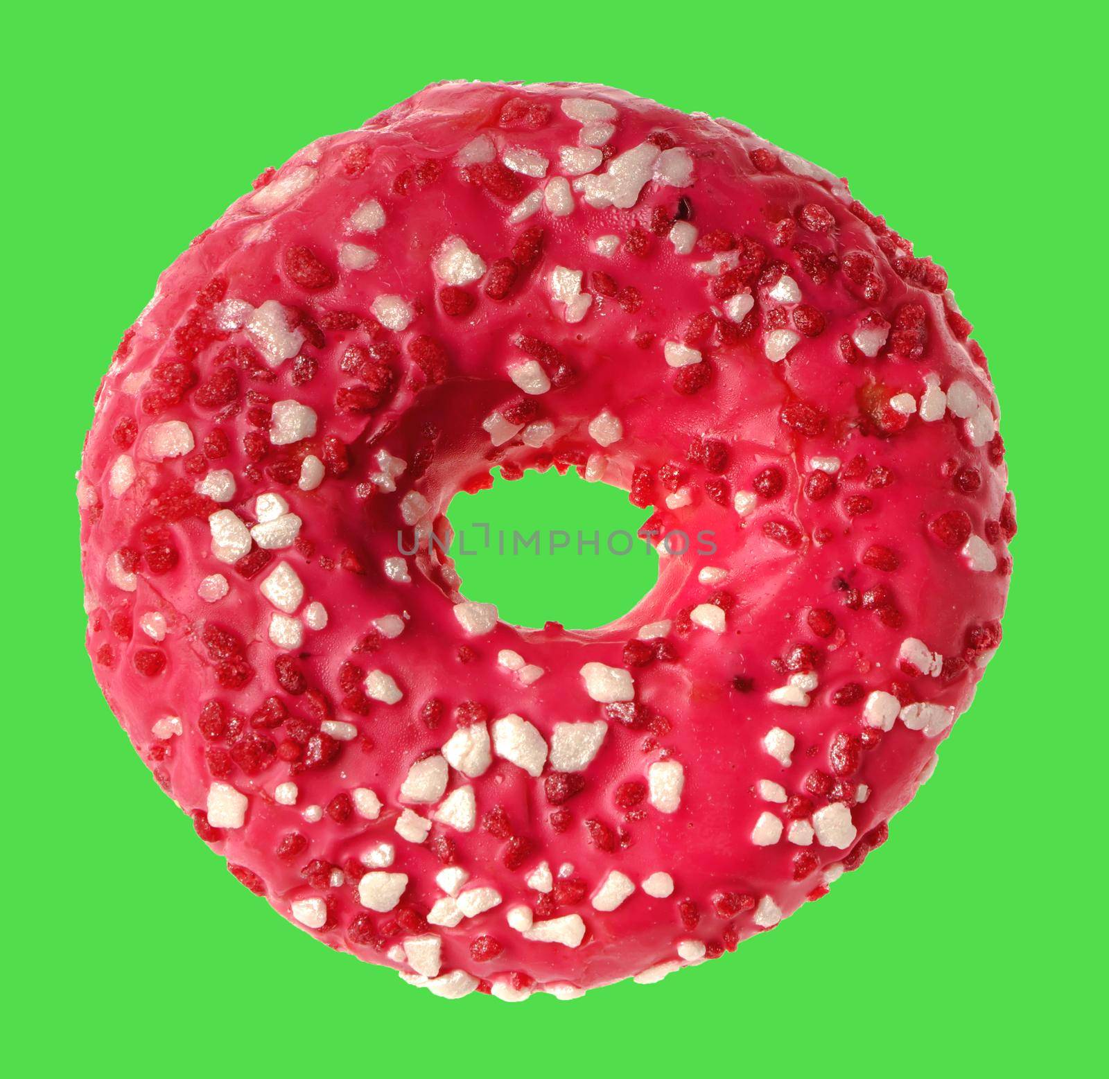 lush donut covered with cream, on a green background in isolation