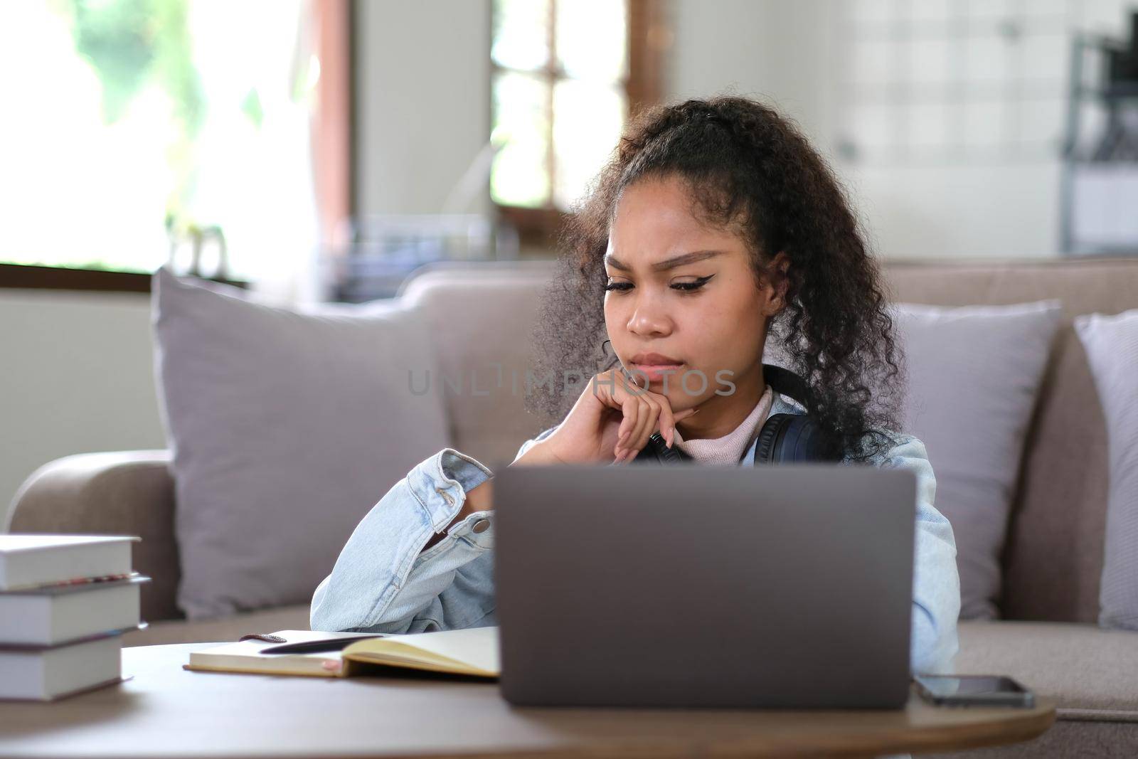 Work from home, Young asian woman struggle with laptop computer, Frustrated asia girl looking at laptop while studying online class, online business, e learning, People struggle with technology by wichayada