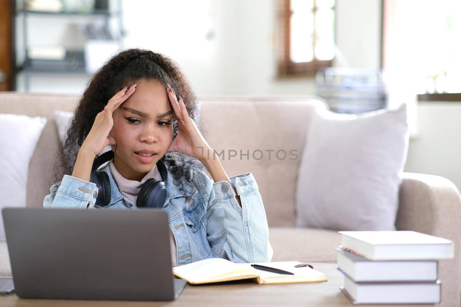 Work from home, Young asian woman struggle with laptop computer, Frustrated asia girl looking at laptop while studying online class, online business, e learning, People struggle with technology.