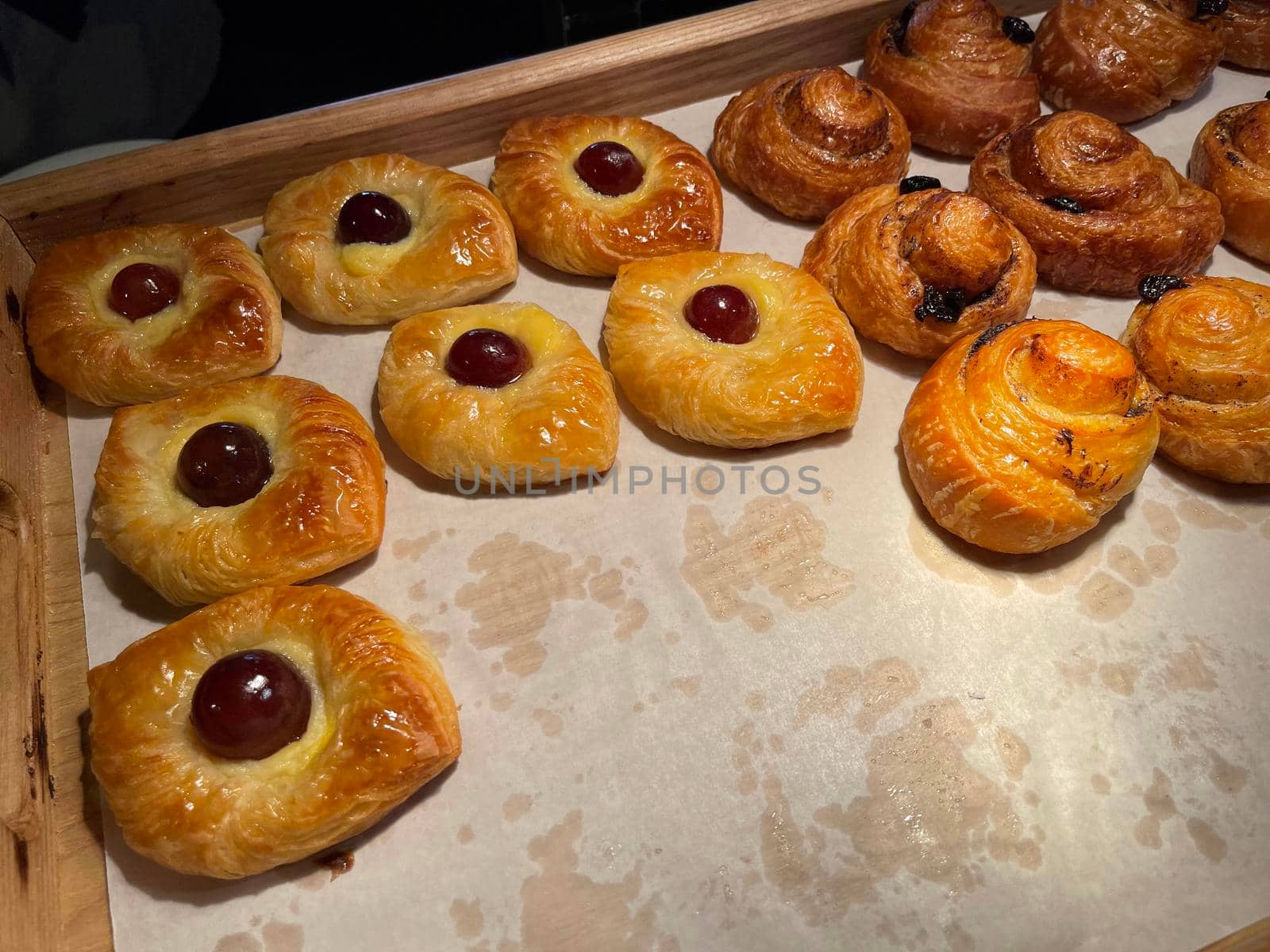 freshly baked danish pastry with apricot jam fruity jelly super delicious warm fresh buttery baked pastries with apricot and peach in bakery kitchen