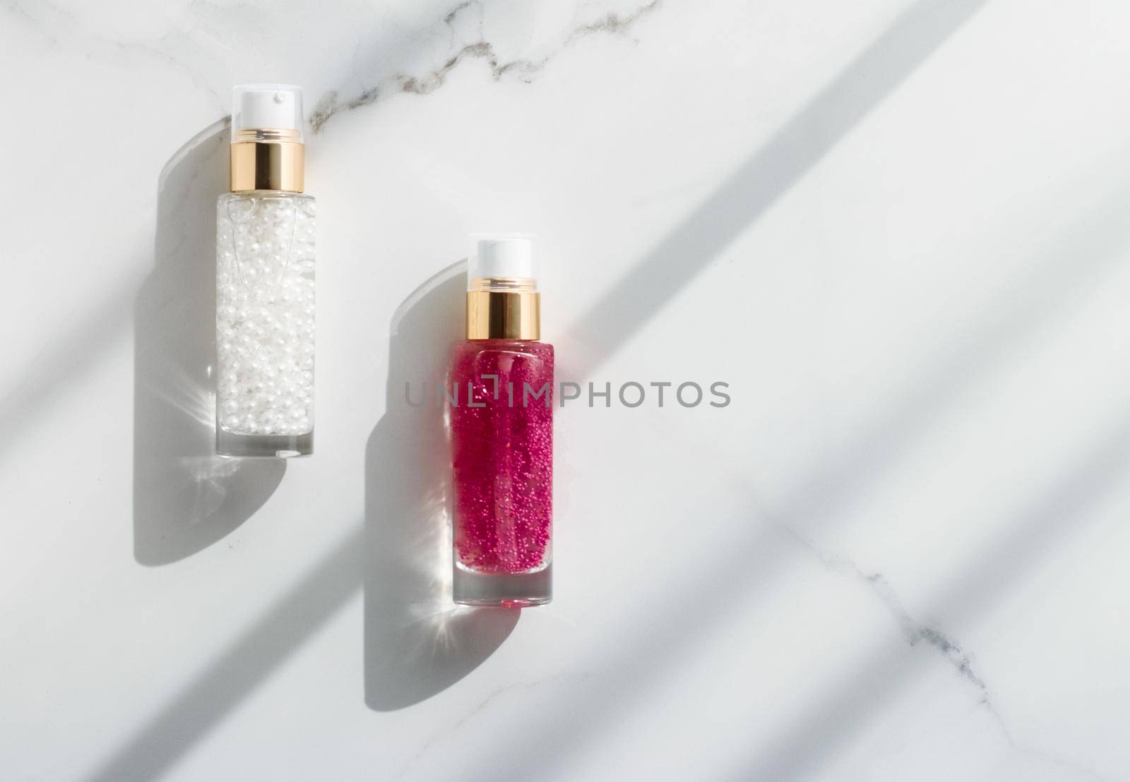 Cosmetic branding, packaging and make-up concept - Skin care serum and gel bottle, moisturizing lotion and lifting cream emulsion on marble, anti-age cosmetics for luxury beauty skincare brand design