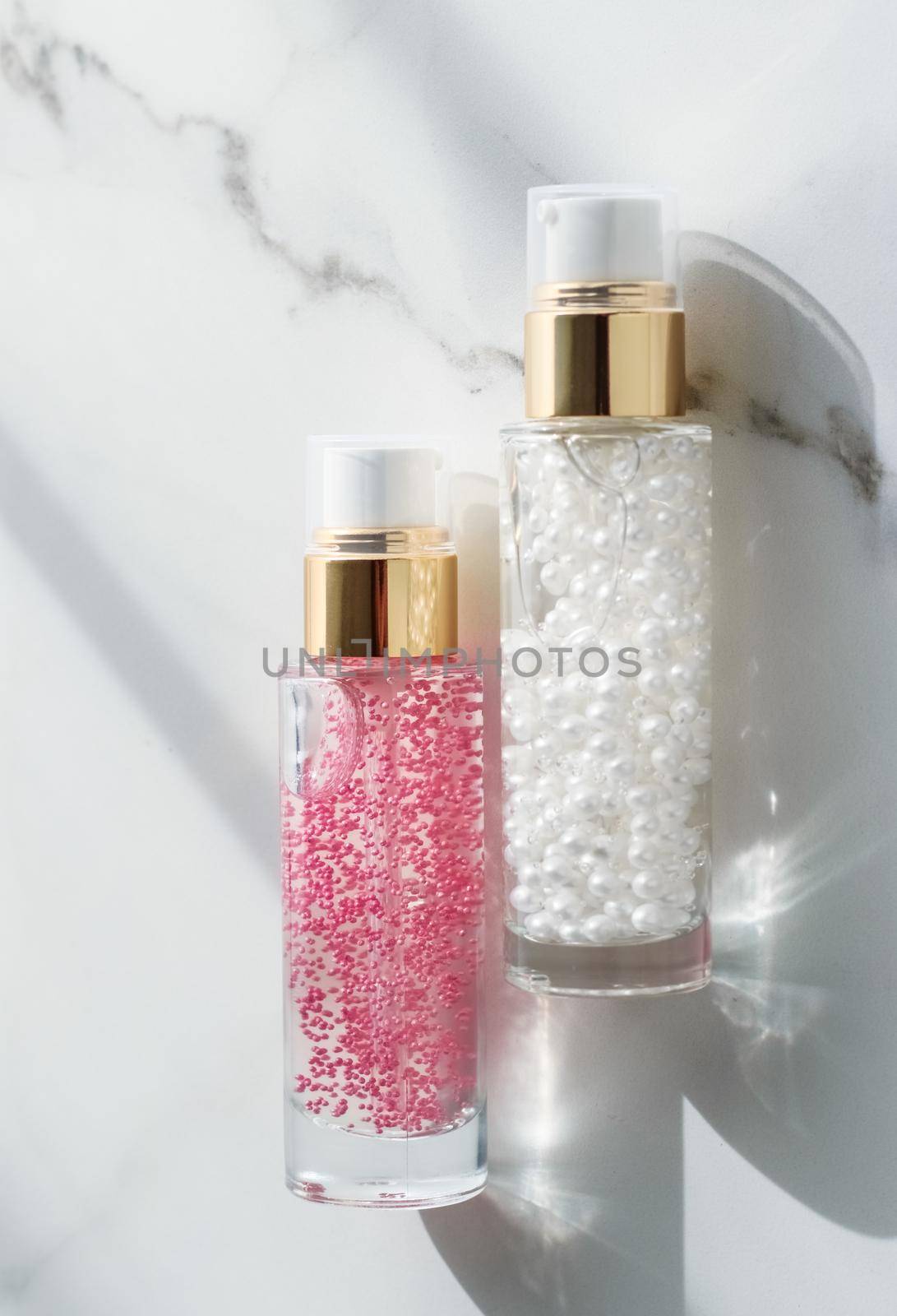 Cosmetic branding, packaging and make-up concept - Skin care serum and gel bottle, moisturizing lotion and lifting cream emulsion on marble, anti-age cosmetics for luxury beauty skincare brand design