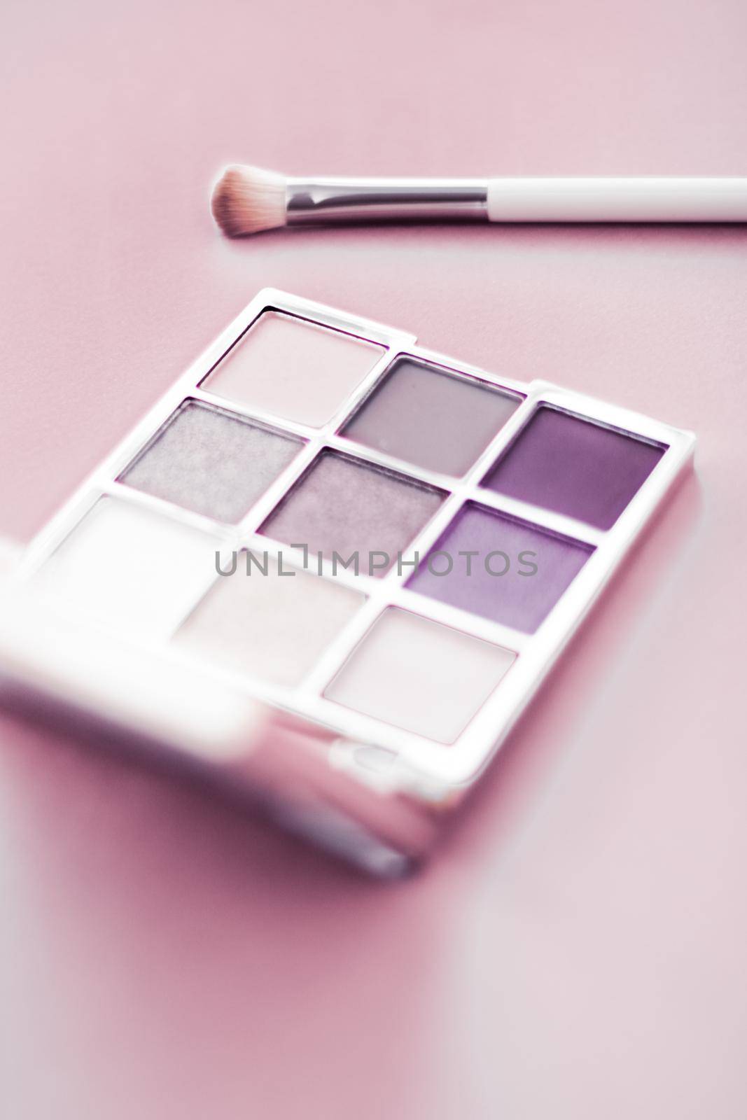 Eyeshadow palette and make-up brush on blush pink background, eye shadows cosmetics product as luxury beauty brand promotion and holiday fashion blog design by Anneleven