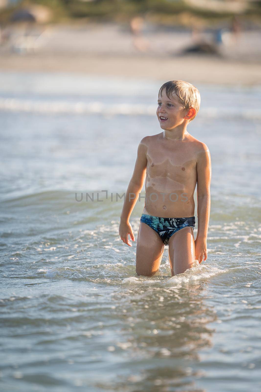 Wet little boy thinking on the water by Robertobinetti70