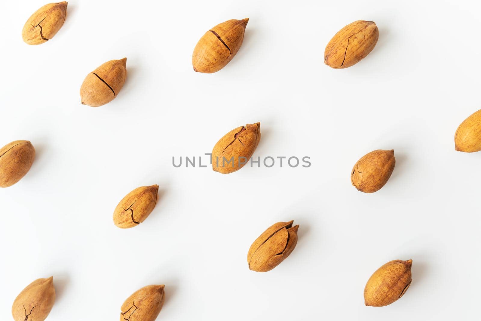 Shelled pecan on a white table. Healthy nuts, vegetarianism. Selective focus