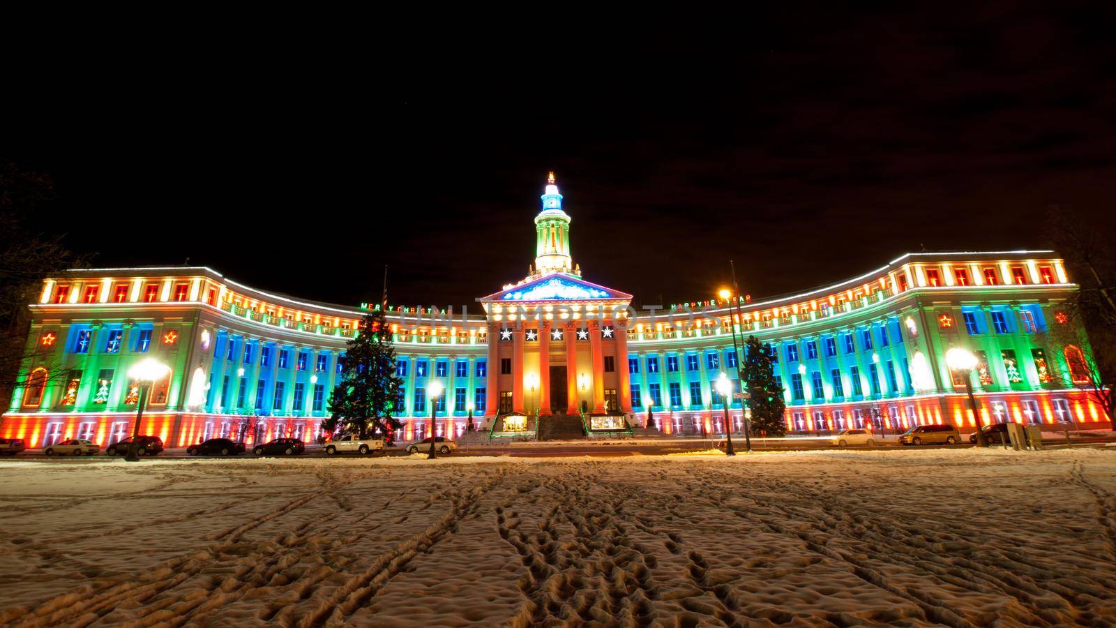 Downtown Denver at Christmas. Denver's City and County building decorated with holiday lights.
