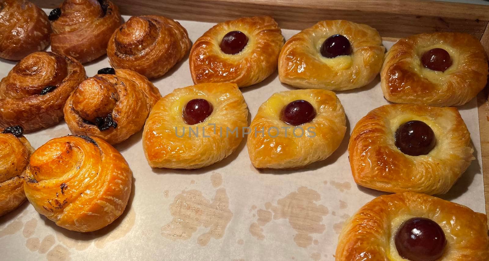 freshly baked danish pastry with apricot jam fruity jelly super delicious warm fresh buttery baked pastries with apricot and peach from baker's kitchen