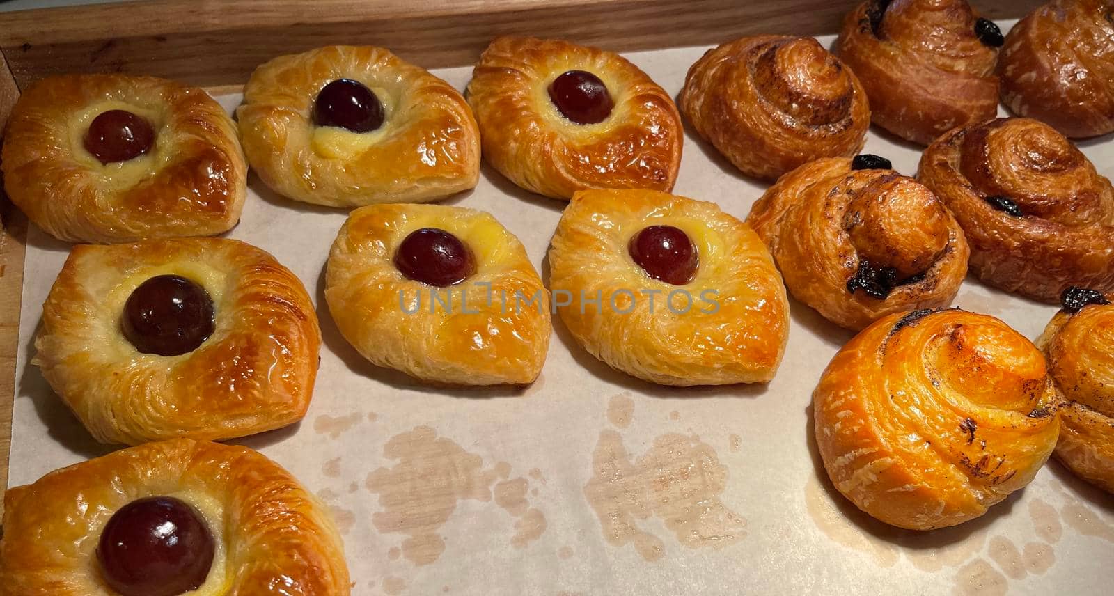 freshly baked danish pastry with apricot jam fruity jelly super delicious warm fresh buttery baked pastries with apricot and peach from baker's kitchen