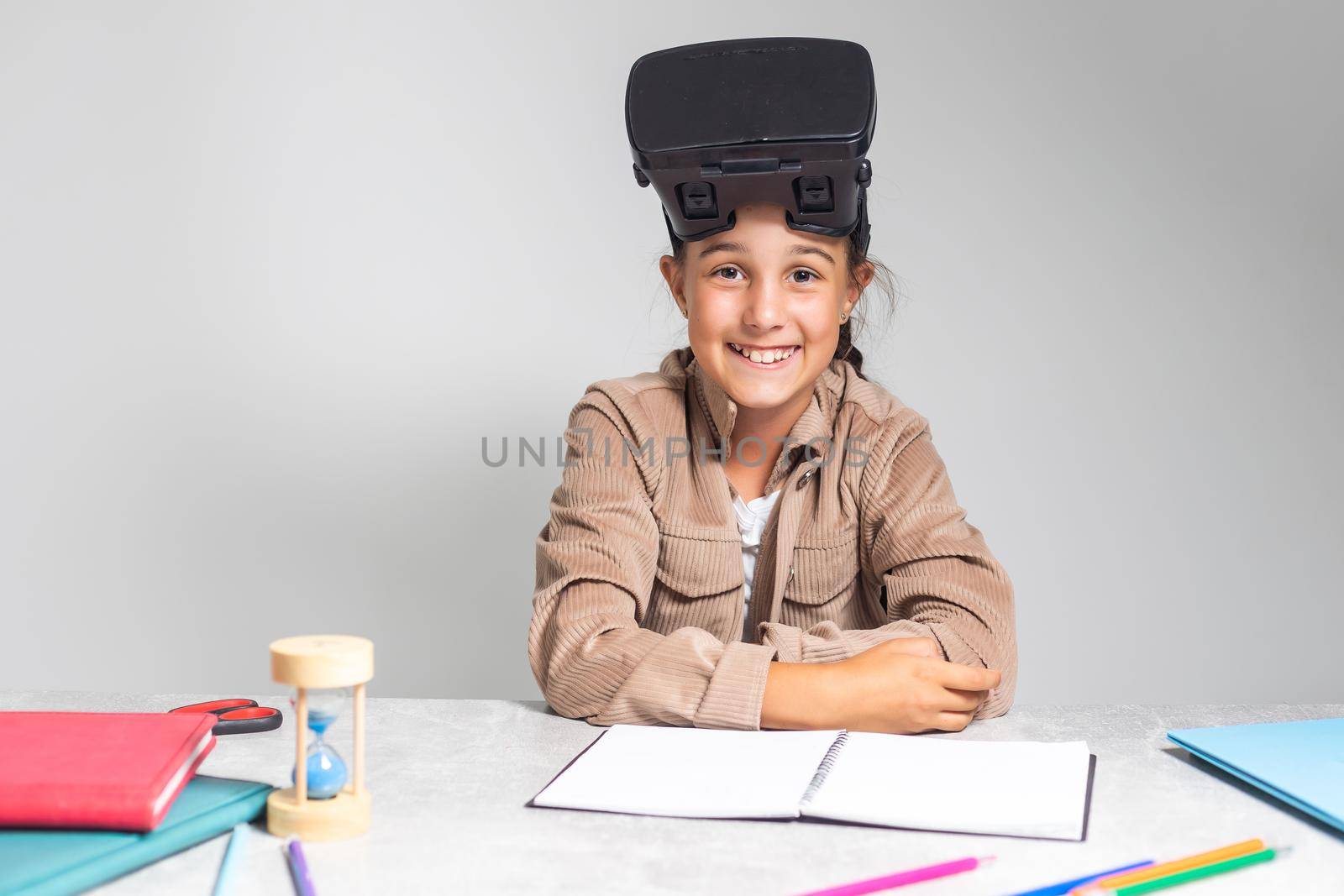 little girl with virtual reality headset. Innovation technology and education concept. by Andelov13