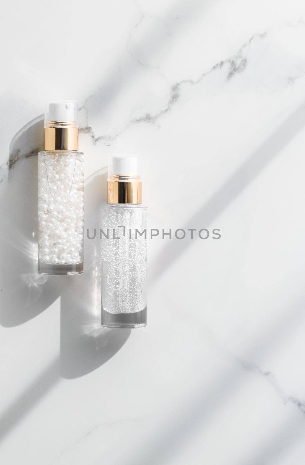 Cosmetic branding, packaging and make-up concept - Skin care serum and gel bottle, moisturizing lotion and lifting cream emulsion on marble, anti-age cosmetics for luxury beauty skincare brand design