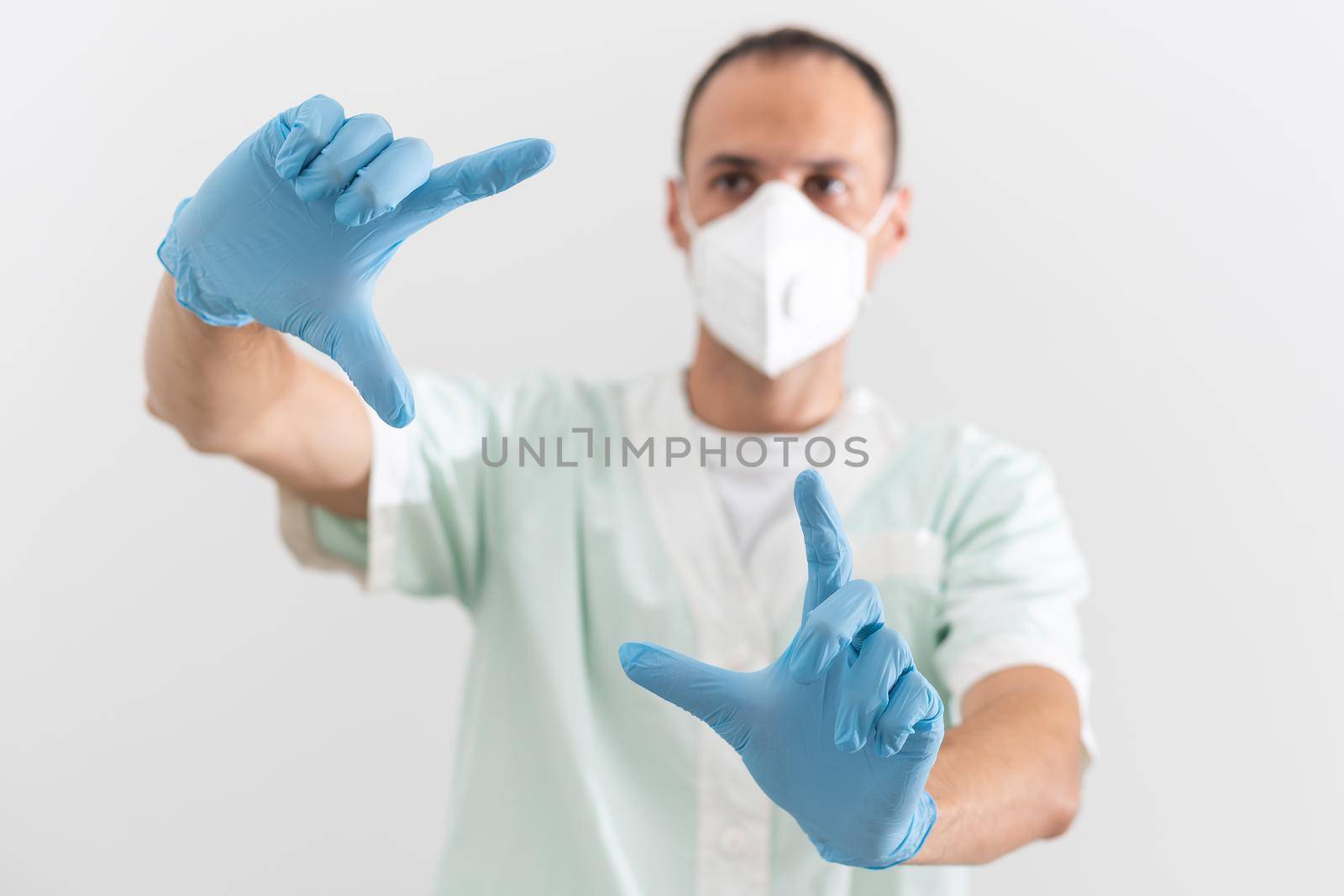 Man doctor medic in a protective respirator and face mask.