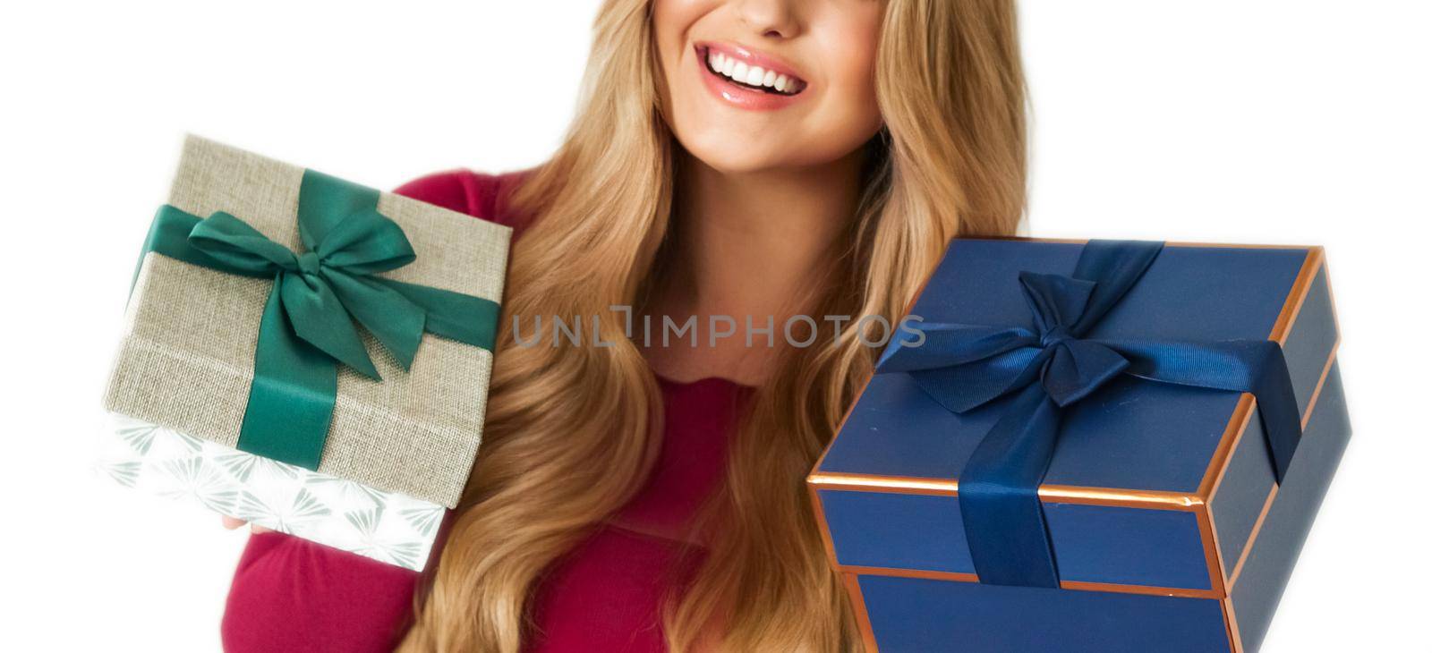 Birthday, Christmas gifts or holiday present, happy woman holding gift boxes isolated on white background, portrait