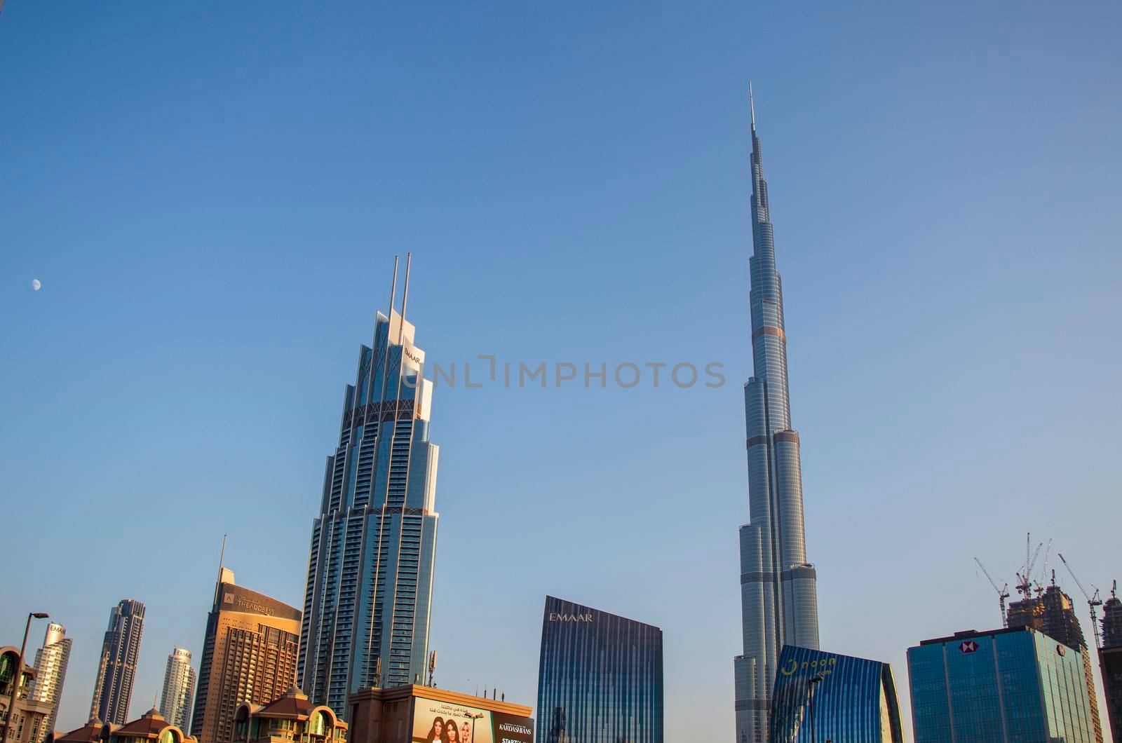 Dubai Financial Center road. Burj Khalifa tallest building in the world can be seen on the scene. Outdoors