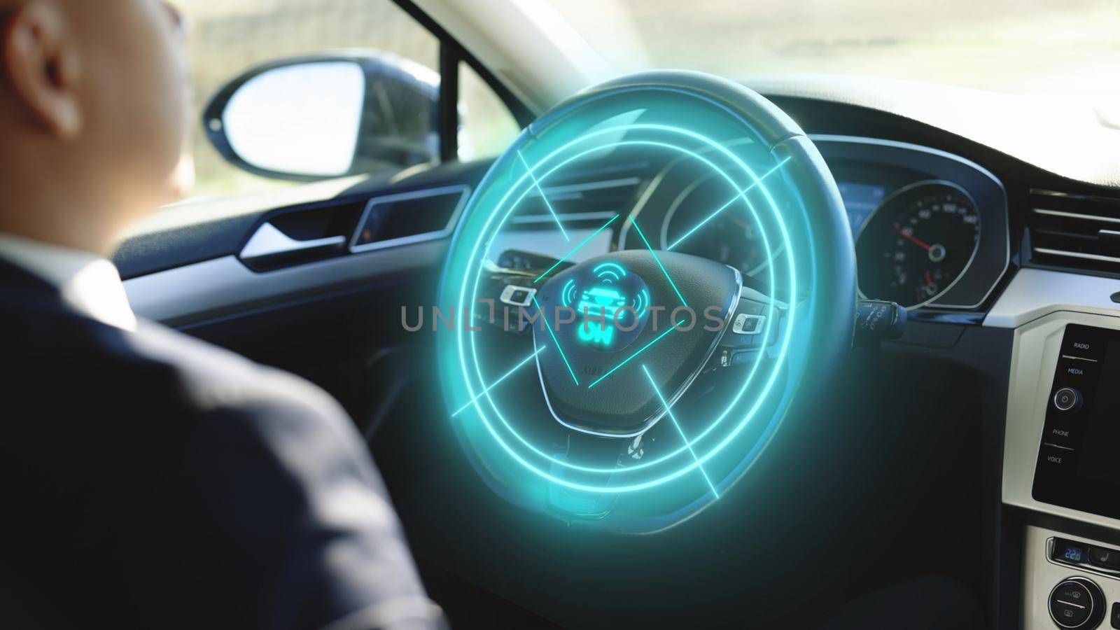 Vehicle starts autonomous self-driving. A man driving futuristic car activates autopilot on augmented reality hologram hud. Businessman Sitting in a Autonomous Self-Driving Zero-Emissions Car.