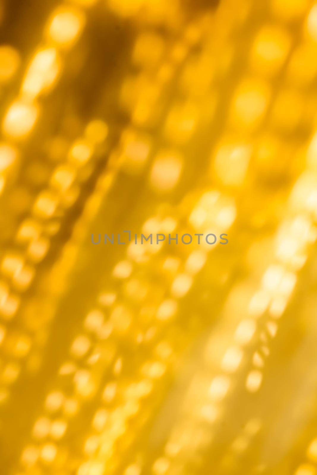 Golden Christmas lights, New Years Eve fireworks and abstract texture concept - Glamorous gold shiny glow and glitter, luxury holiday background