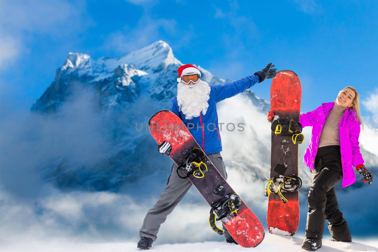 family and snowboard on snowy mountain.