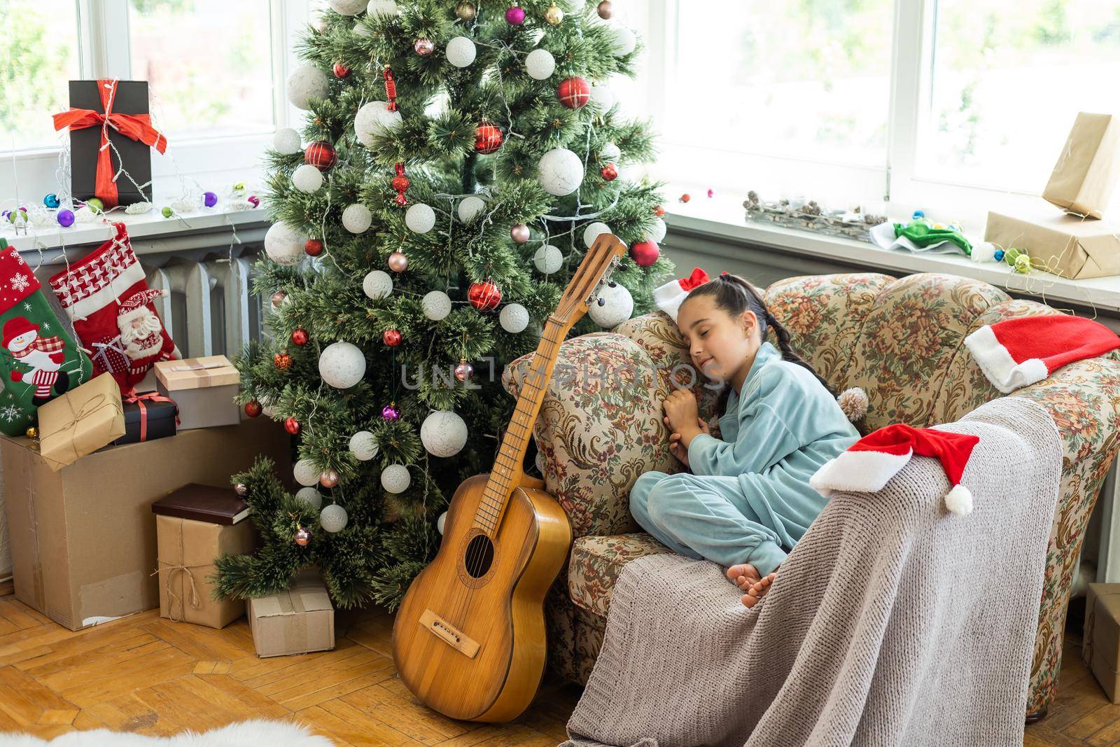 little girl near a christmas tree by Andelov13