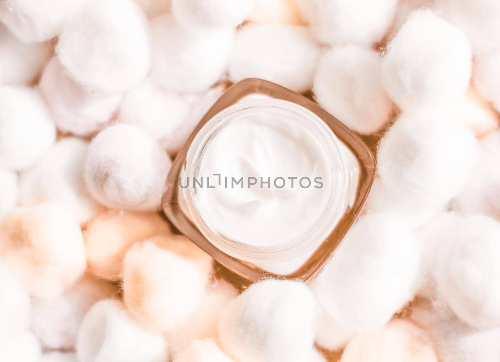 Cosmetic branding, moisturizing emulsion and facial care concept - Luxury face cream for sensitive skin and orange cotton balls on background, spa cosmetics and natural skincare beauty brand product