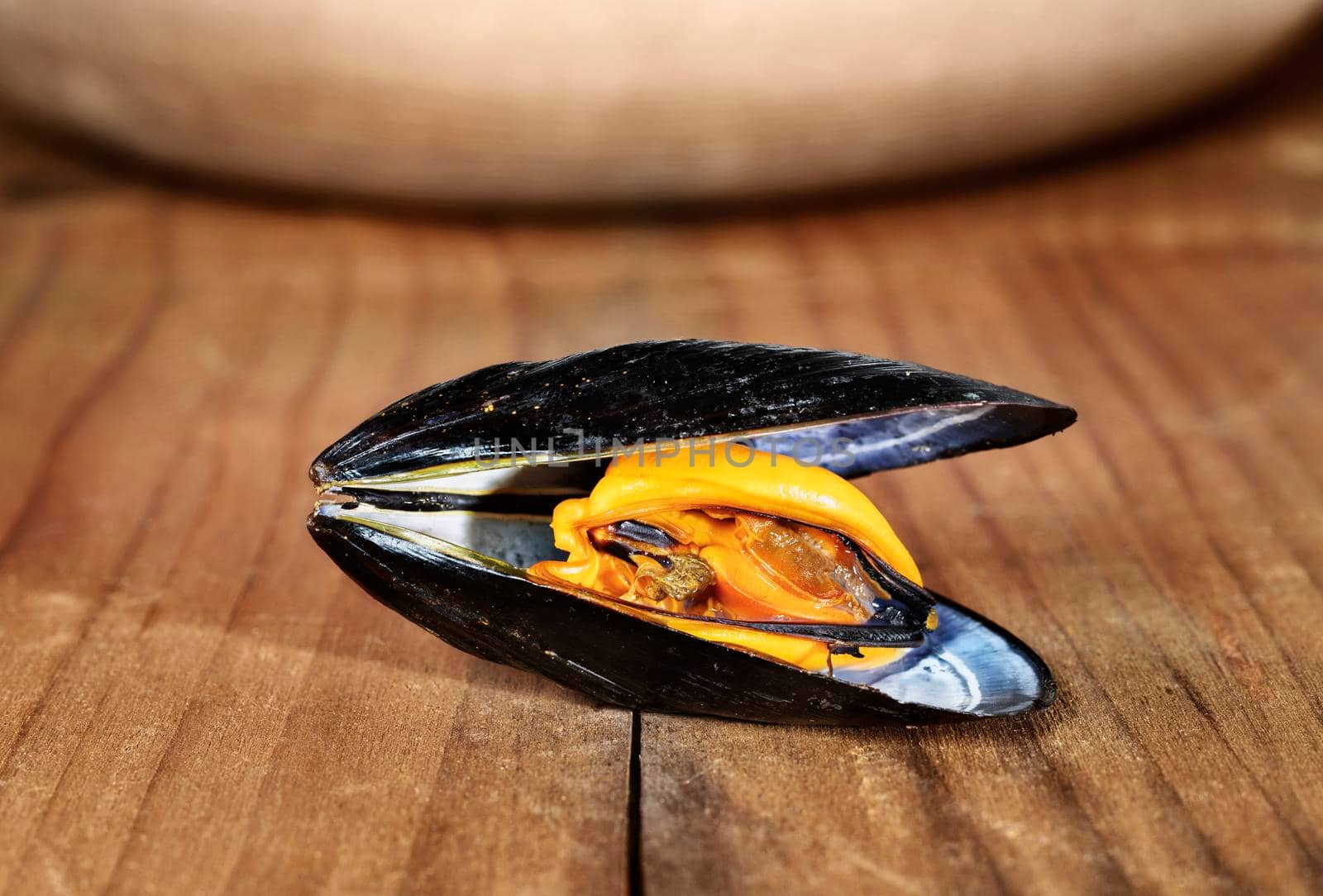 Opened mussel fish on wooden table ,  healthy eating food