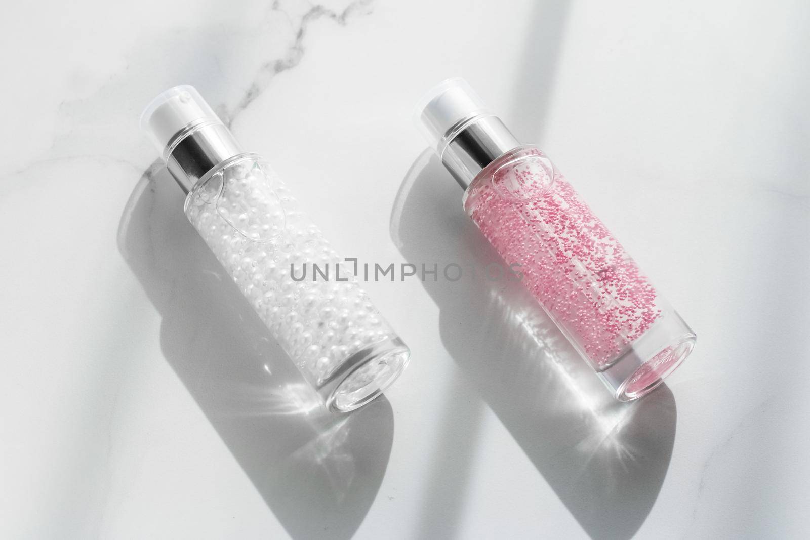 Cosmetic branding, packaging and make-up concept - Skin care serum and gel bottle, moisturizing lotion and lifting cream emulsion on marble, anti-age cosmetics for luxury beauty skincare brand design