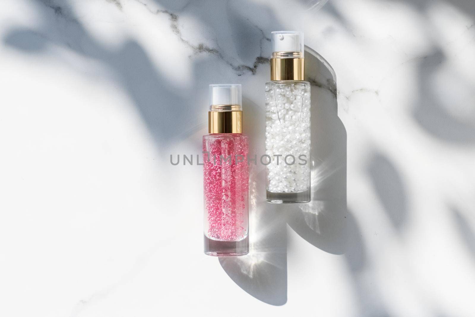 Cosmetic branding, packaging and make-up concept - Skin care serum and gel bottle, moisturizing lotion and lifting cream emulsion on marble, anti-age cosmetics for luxury beauty skincare brand design